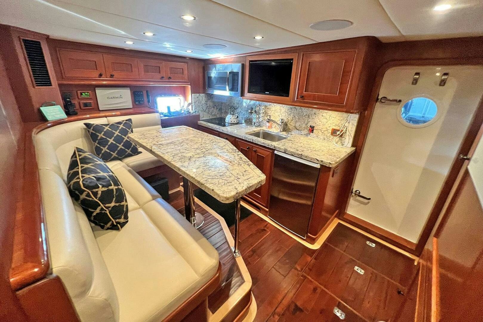 a kitchen with a couch and a table aboard INSIGNIA Yacht for Sale