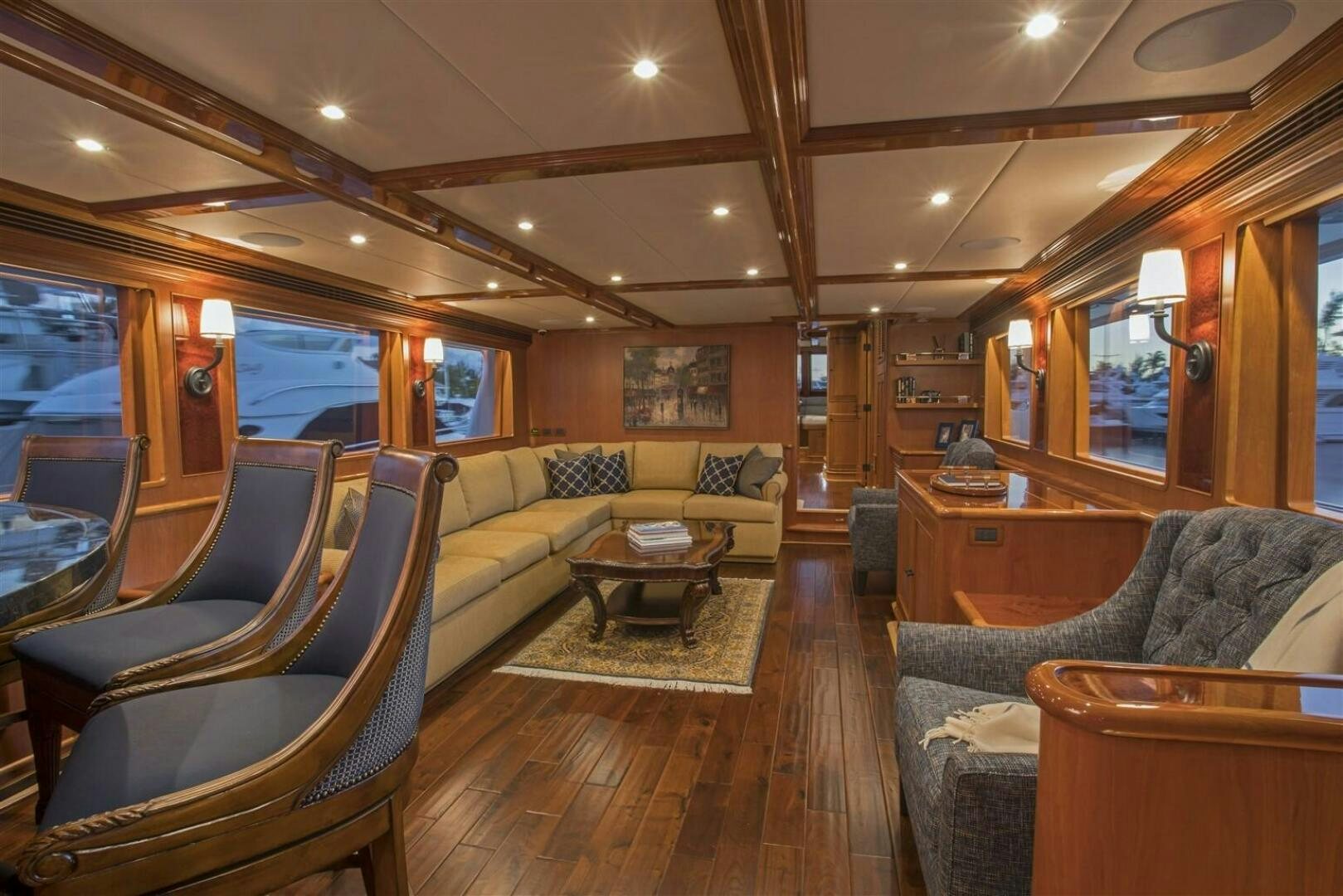 a living room with a couch and a table aboard INSIGNIA Yacht for Sale