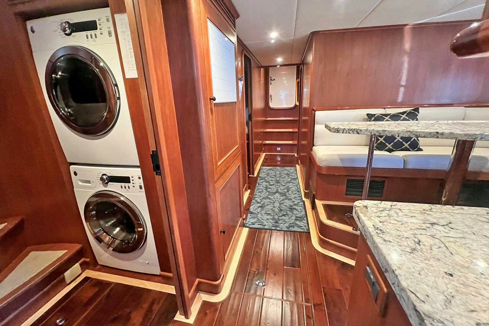a room with a washing machine and a counter aboard INSIGNIA Yacht for Sale