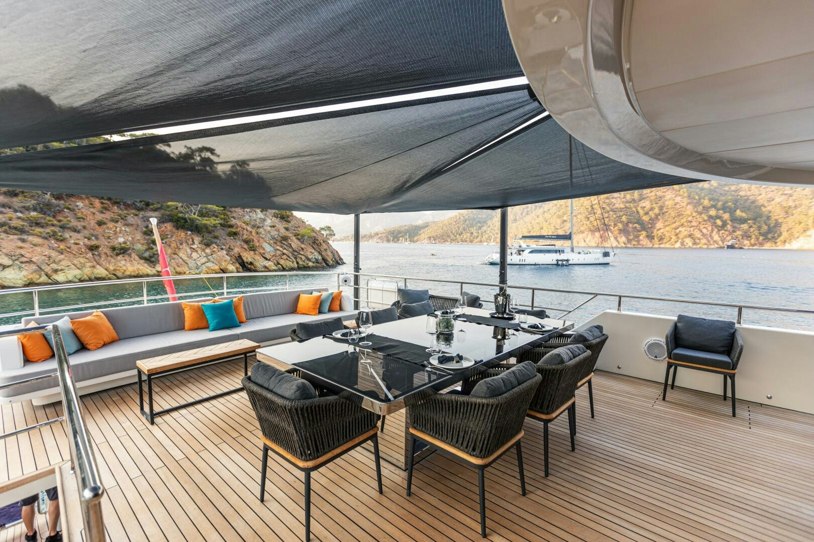 a table and chairs on a deck aboard ZEEMAR Yacht for Sale