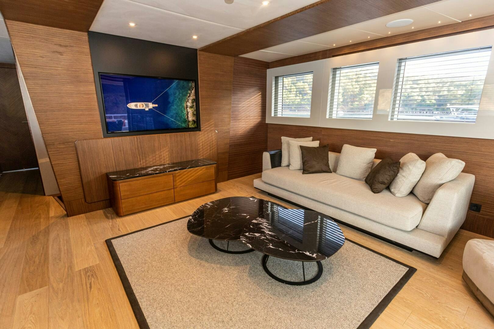 a living room with a couch and a tv aboard ZEEMAR Yacht for Sale