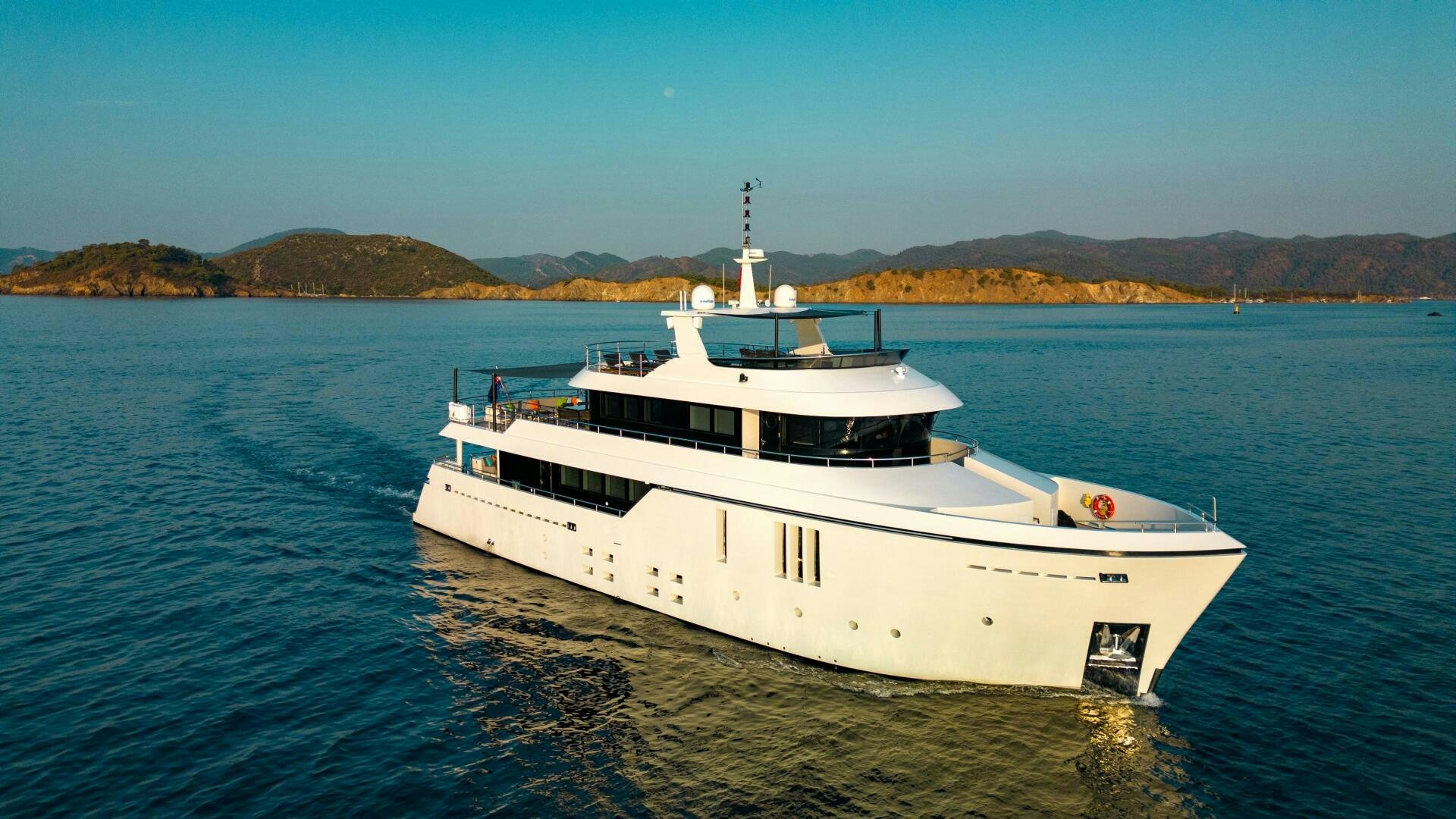 a white boat on the water aboard ZEEMAR Yacht for Sale