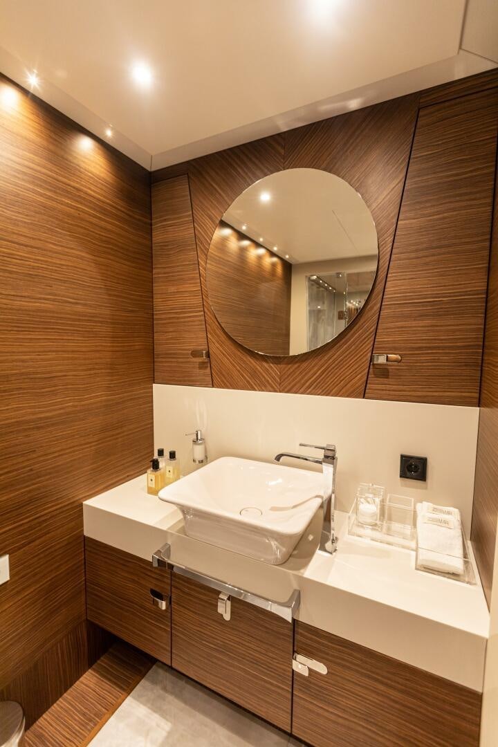 a bathroom with a large mirror aboard ZEEMAR Yacht for Sale