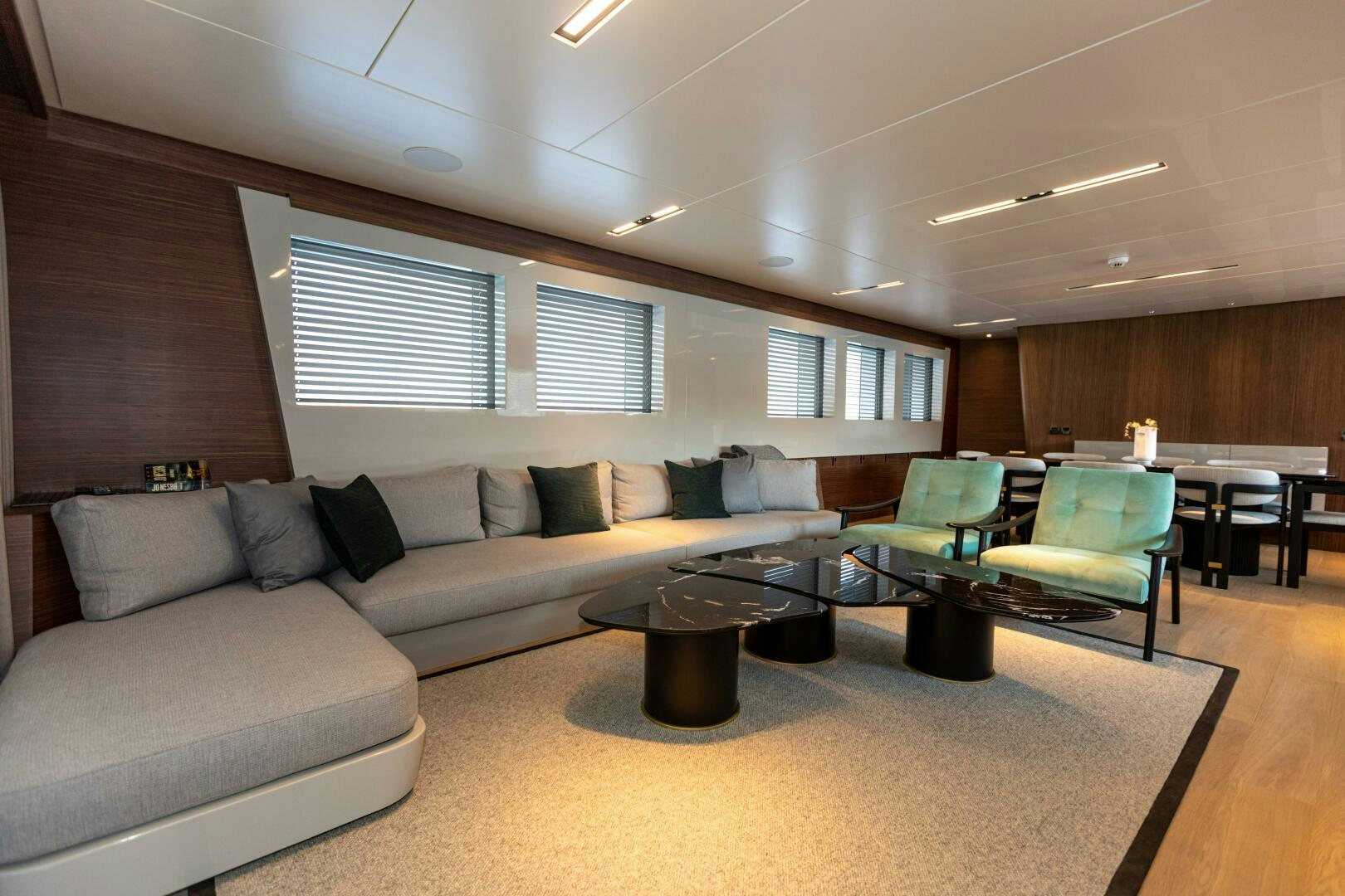 a living room with a couch and a table aboard ZEEMAR Yacht for Sale