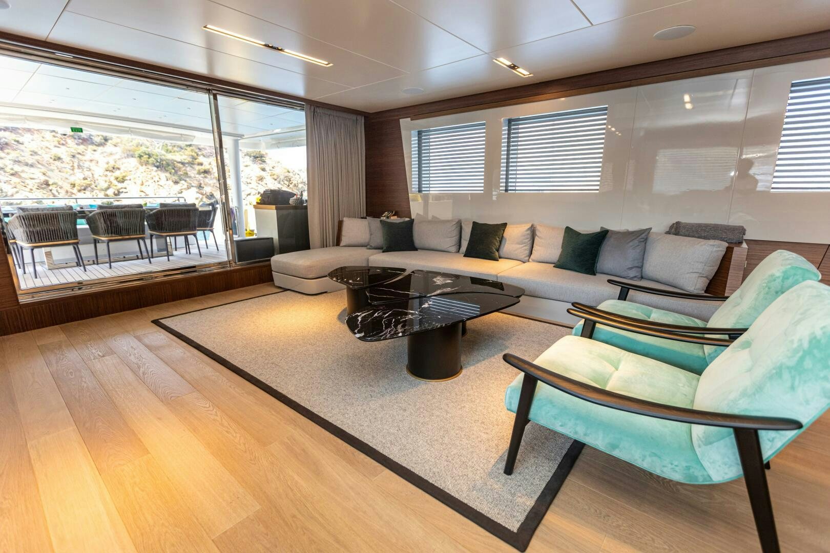a living room with a couch and a coffee table aboard ZEEMAR Yacht for Sale