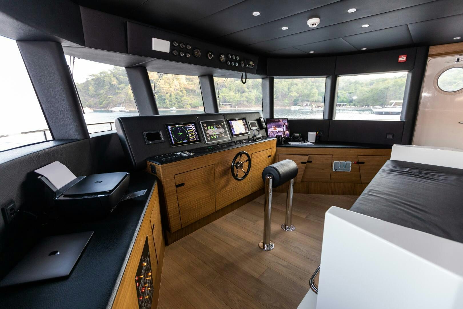 inside of a vehicle with a desk and a computer aboard ZEEMAR Yacht for Sale