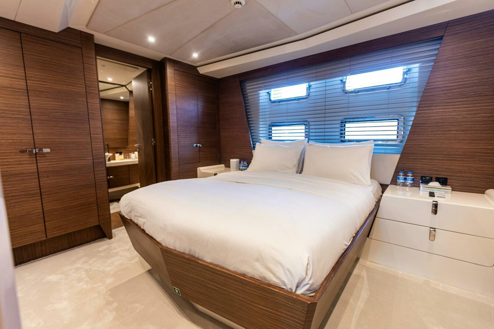 a room with a bed and a window aboard ZEEMAR Yacht for Sale