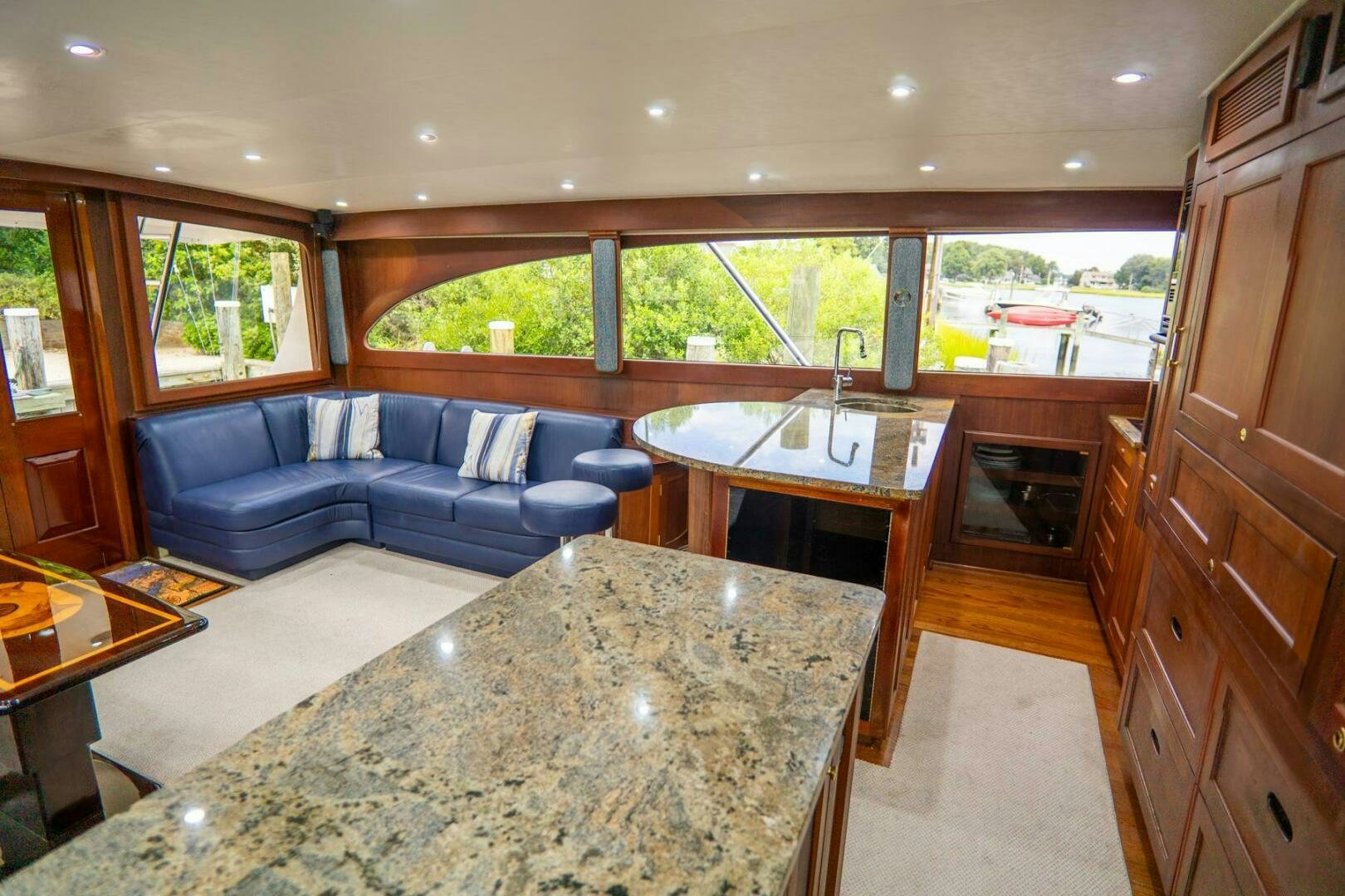 a kitchen and living room area aboard BIG BLUE Yacht for Sale