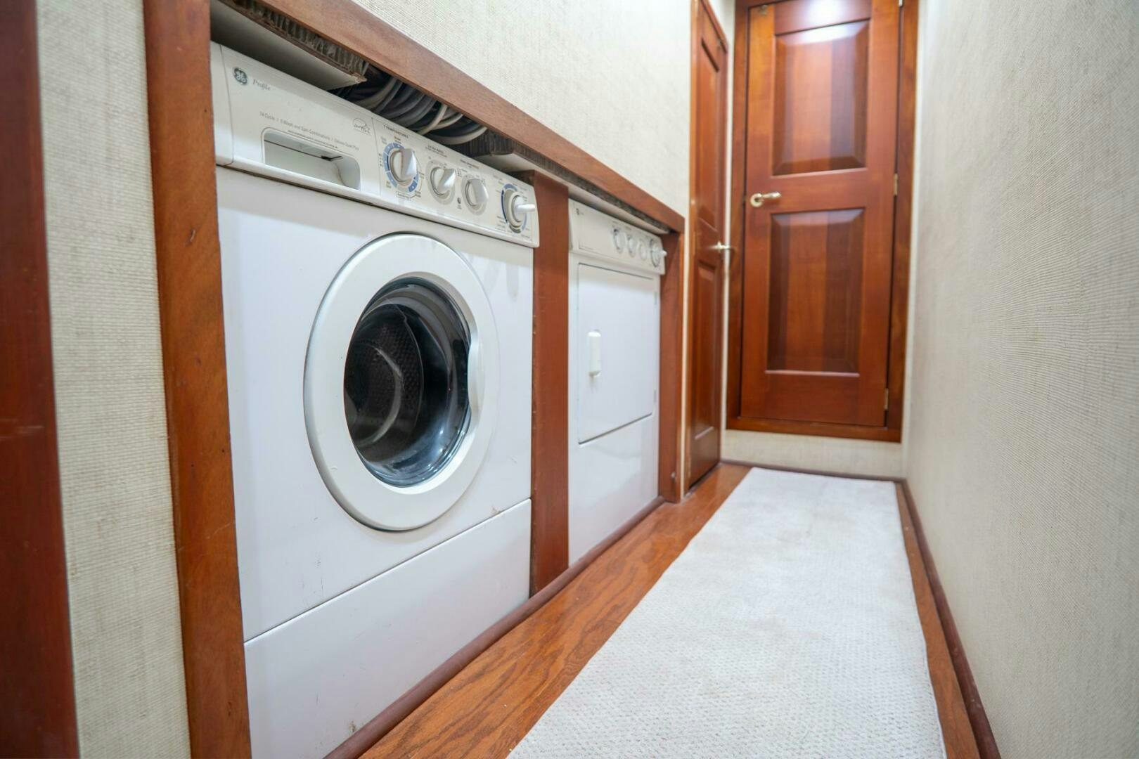 a washing machine in a room aboard BIG BLUE Yacht for Sale
