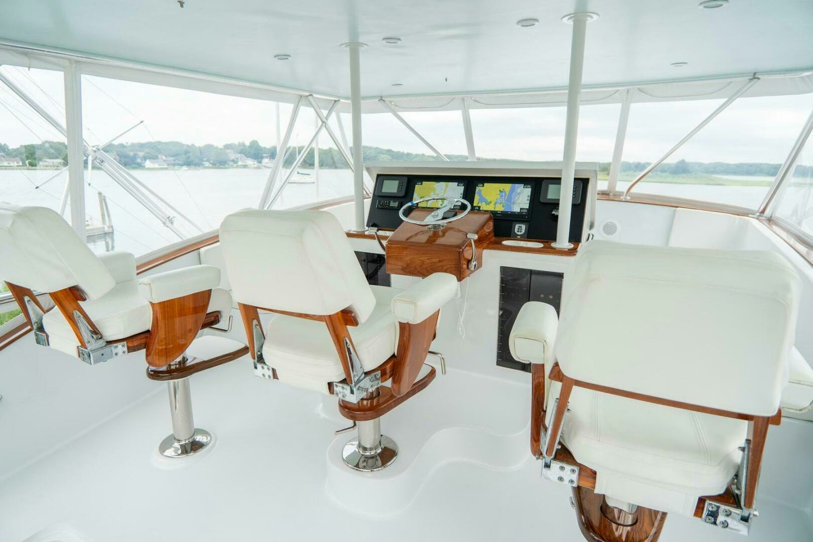 a group of chairs in a room aboard BIG BLUE Yacht for Sale
