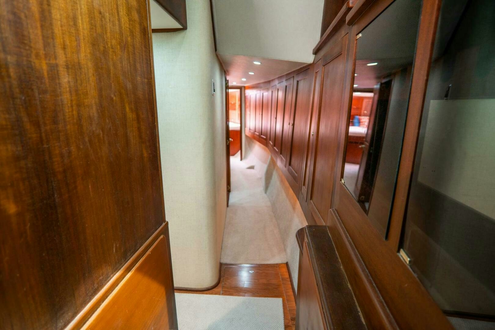 a hallway with wooden walls aboard BIG BLUE Yacht for Sale