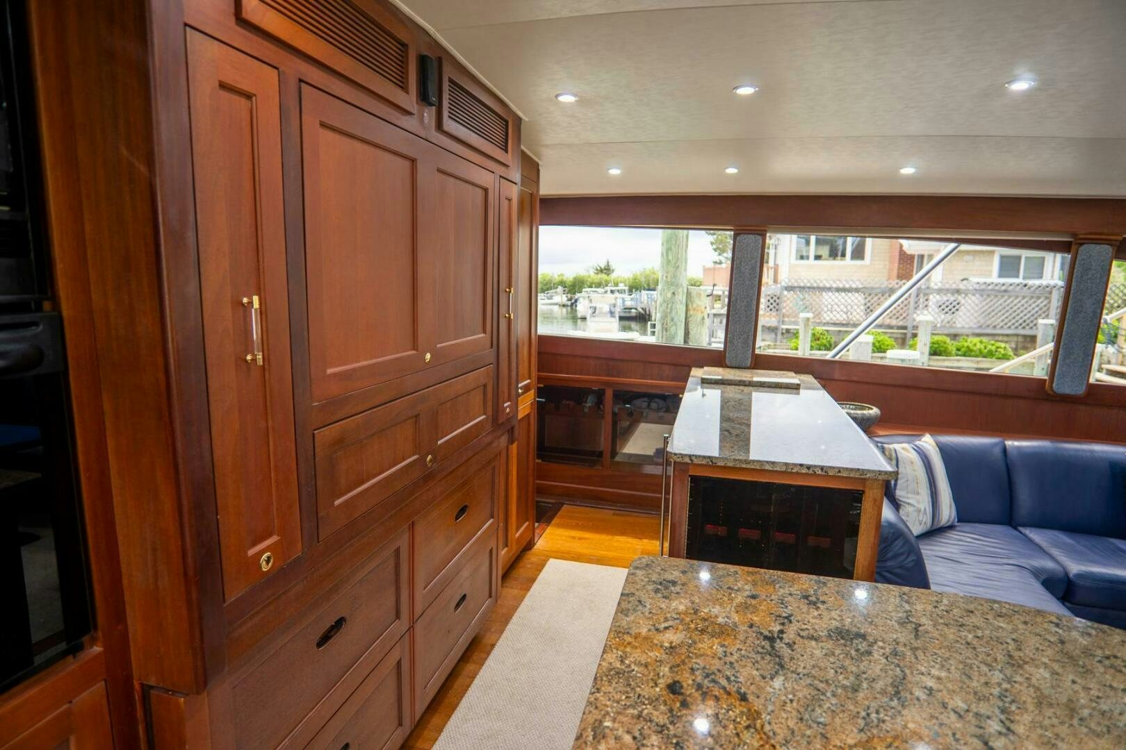 a kitchen with a table and a couch aboard BIG BLUE Yacht for Sale