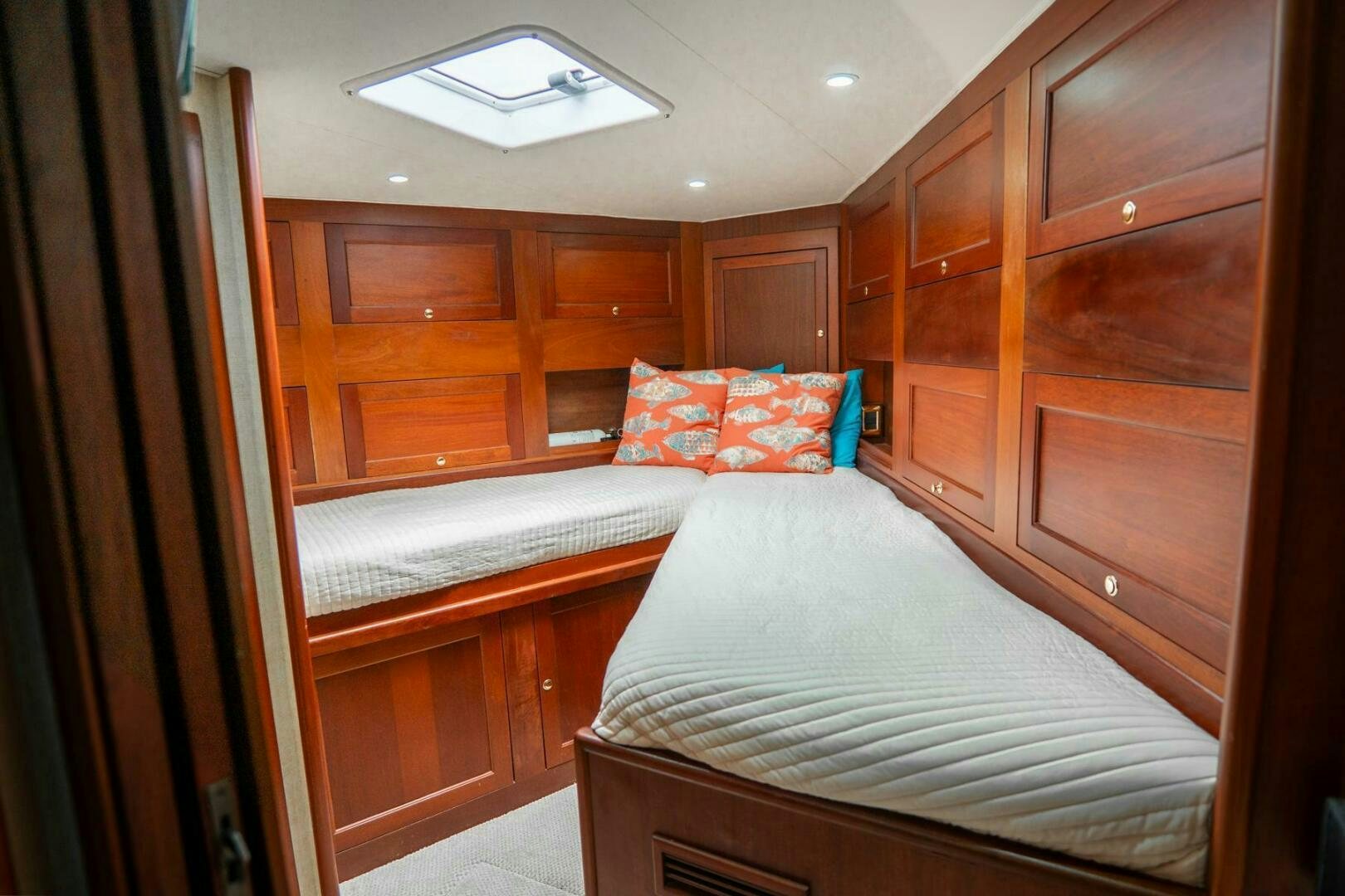 a room with wooden cabinets aboard BIG BLUE Yacht for Sale