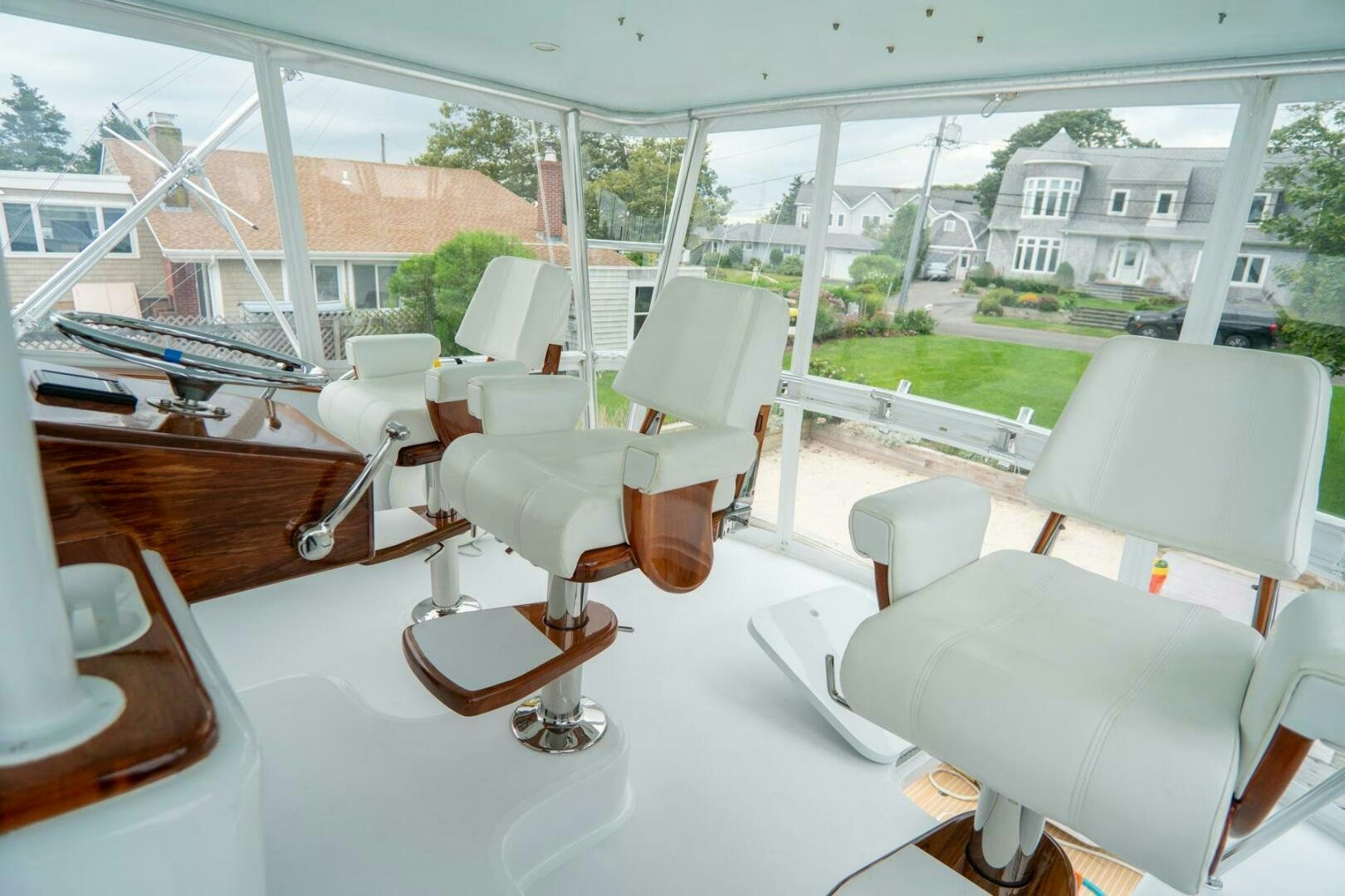 a room with chairs and a table aboard BIG BLUE Yacht for Sale