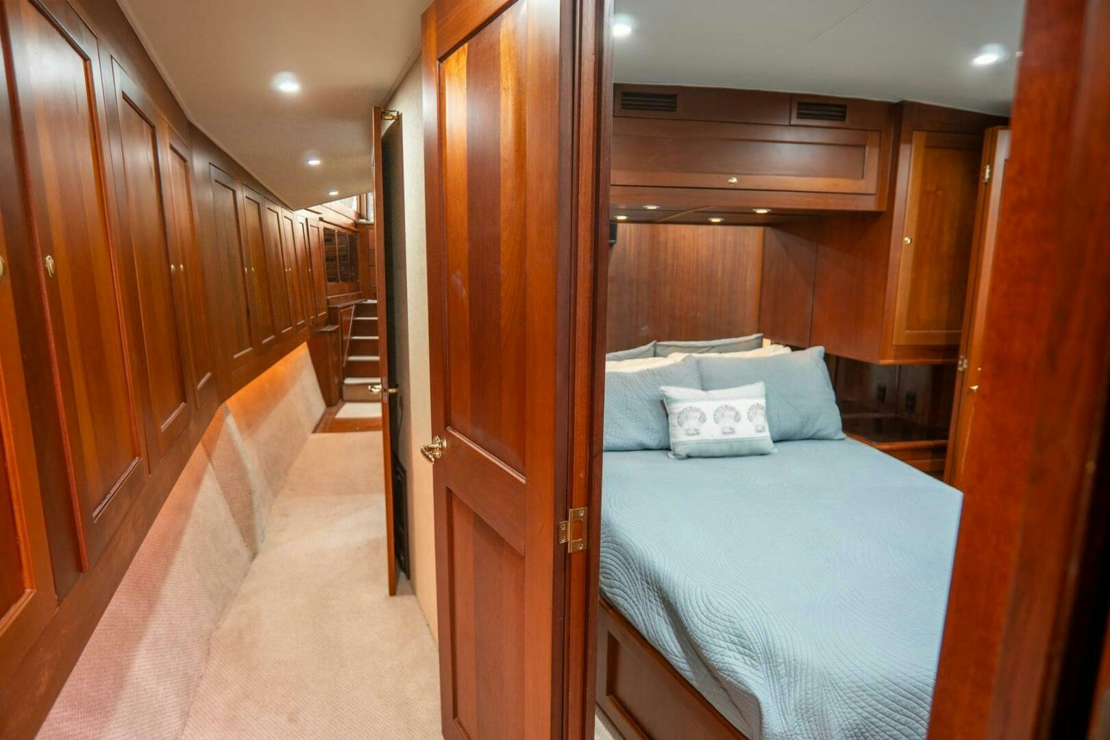 a bed in a room aboard BIG BLUE Yacht for Sale