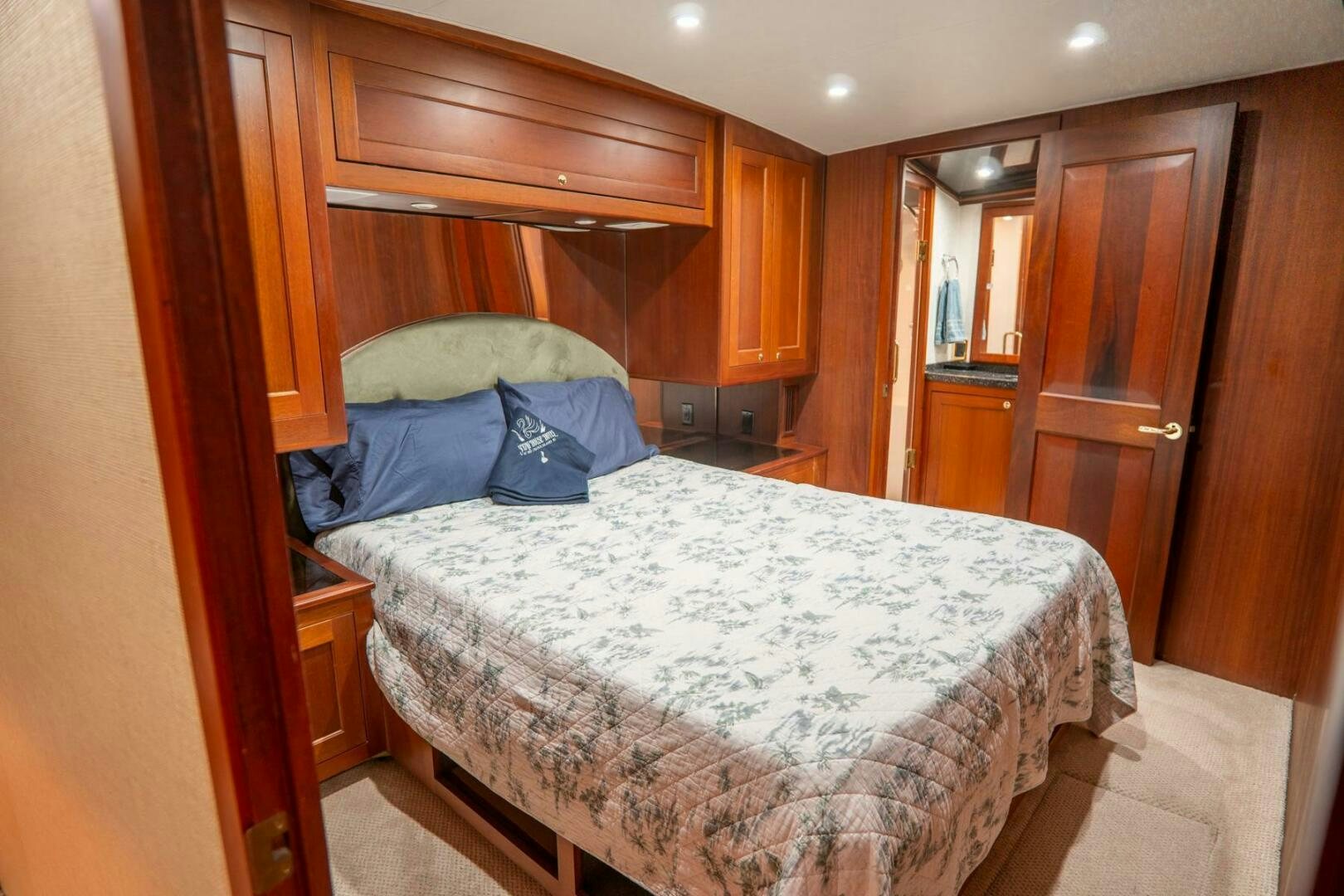 a bed in a room aboard BIG BLUE Yacht for Sale