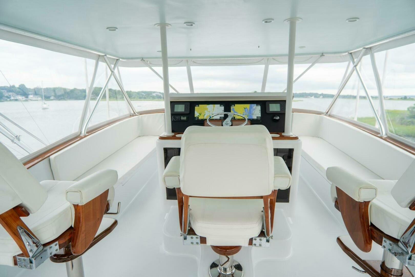 a boat with chairs and a table aboard BIG BLUE Yacht for Sale