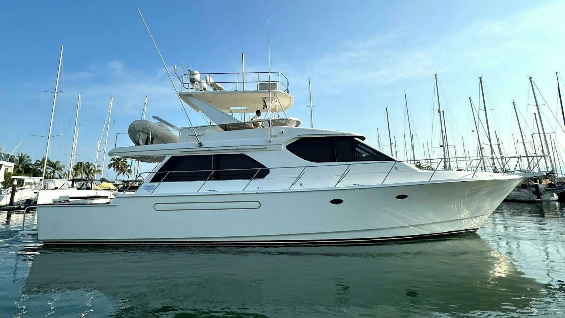 a white yacht in the water aboard Dos amigos Yacht for Sale