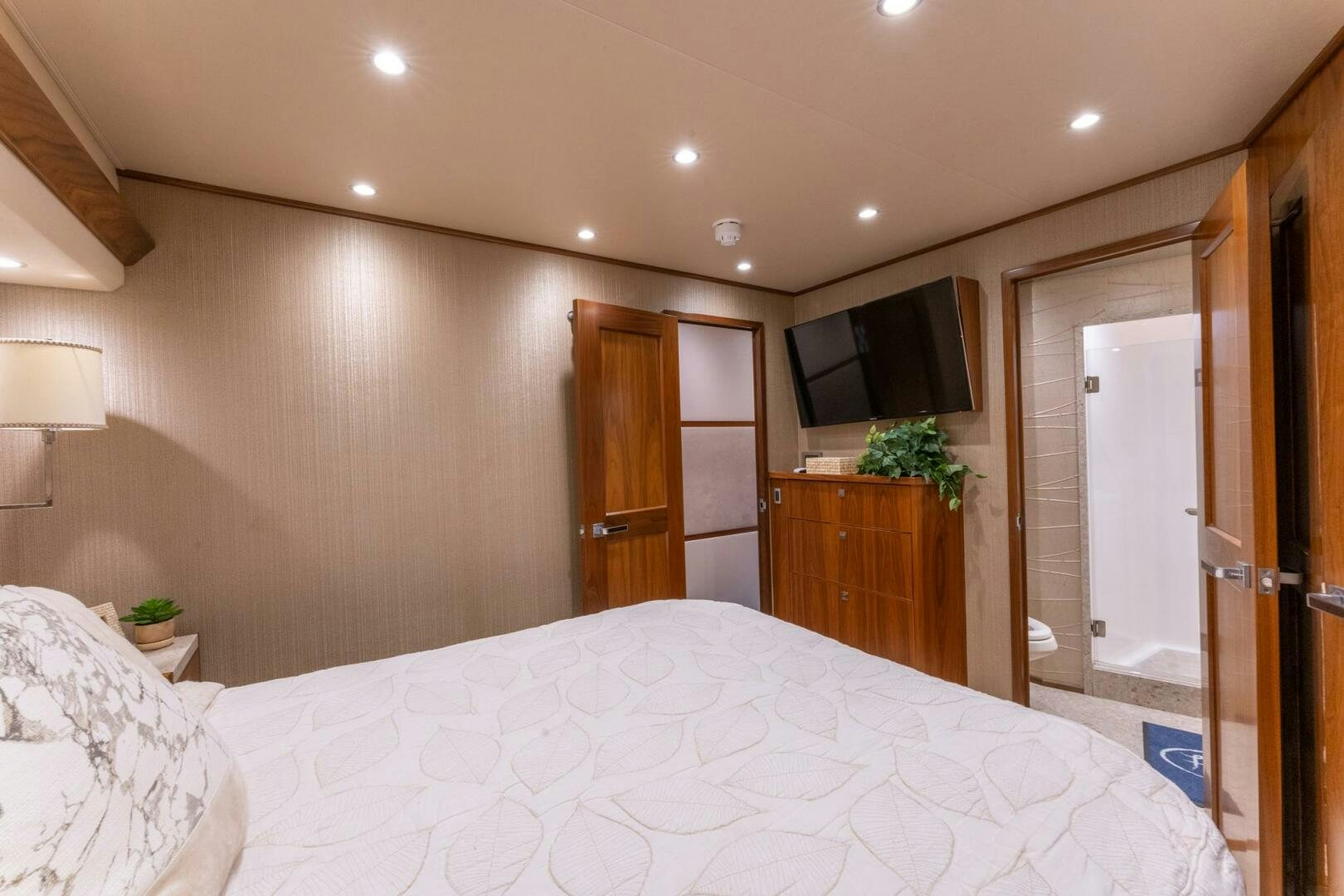 a large bedroom with a large bed aboard HIGH COTTON Yacht for Sale
