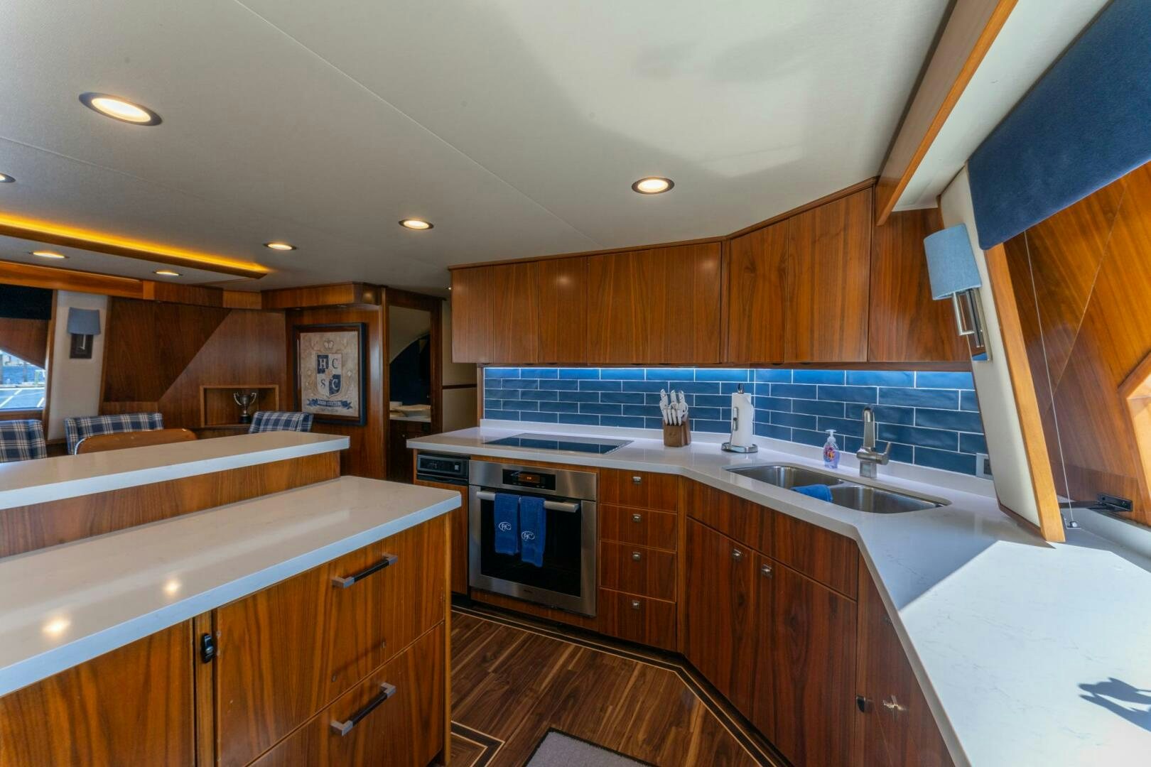 a kitchen with wooden cabinets aboard HIGH COTTON Yacht for Sale