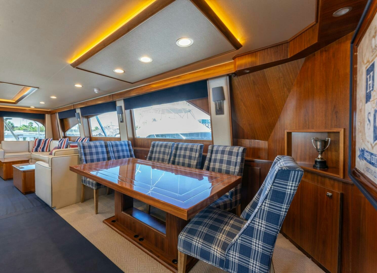 a room with couches and a table aboard HIGH COTTON Yacht for Sale