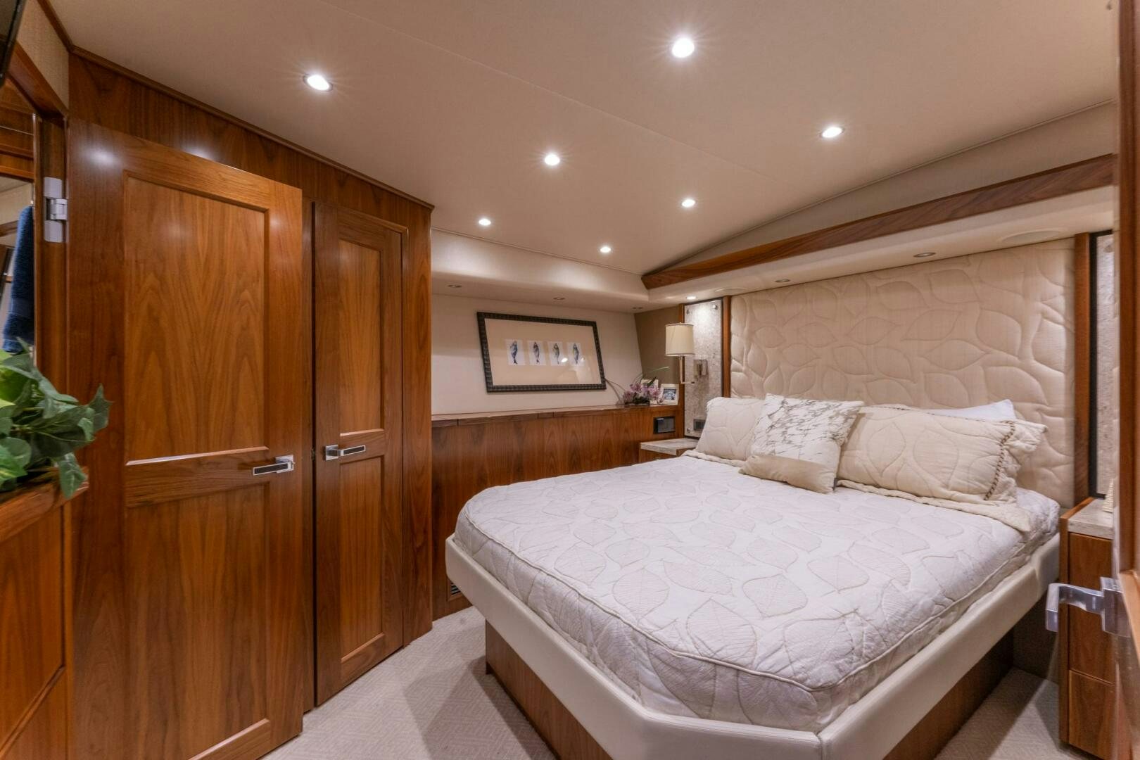 a bed in a room aboard HIGH COTTON Yacht for Sale