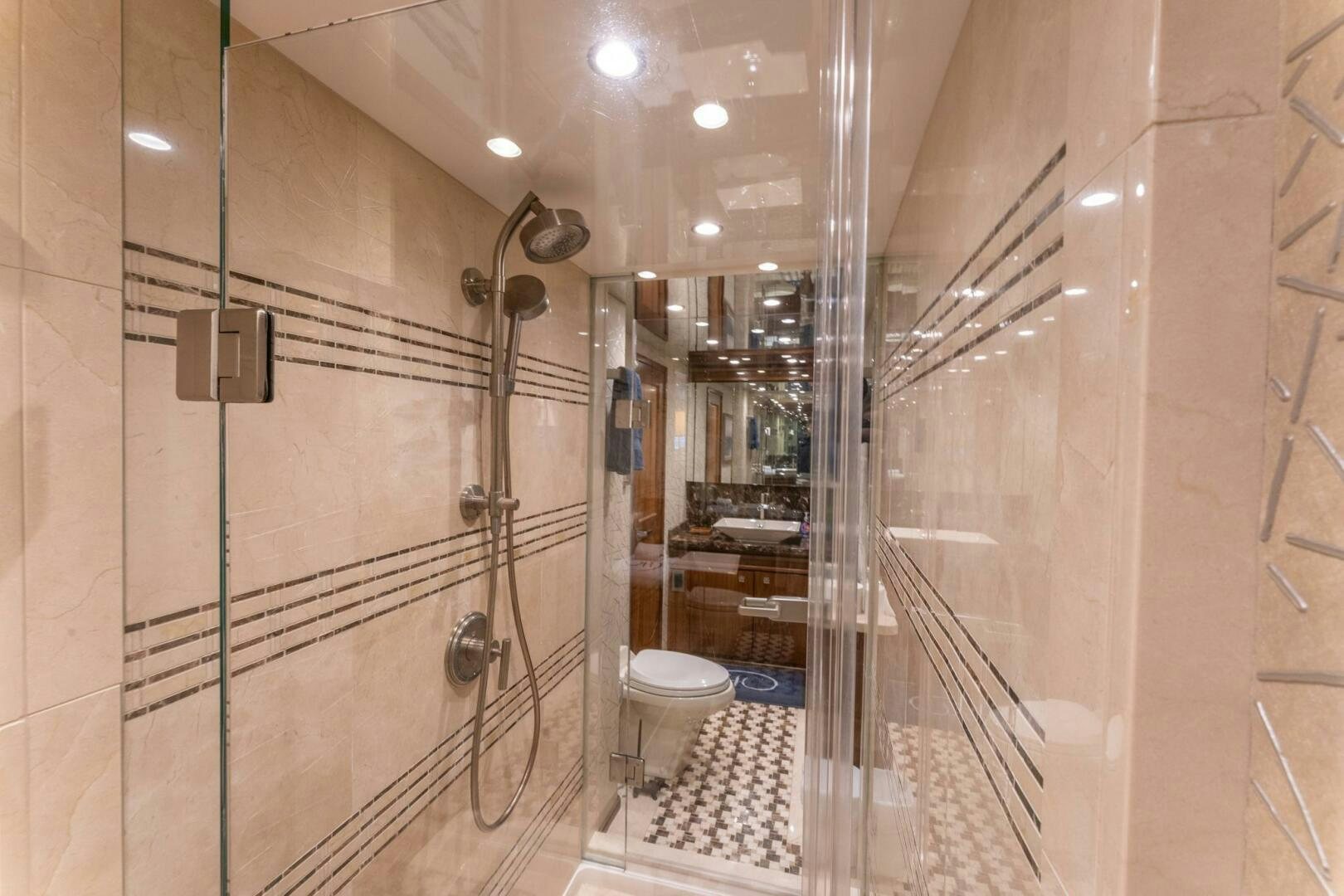 a bathroom with a glass shower aboard HIGH COTTON Yacht for Sale