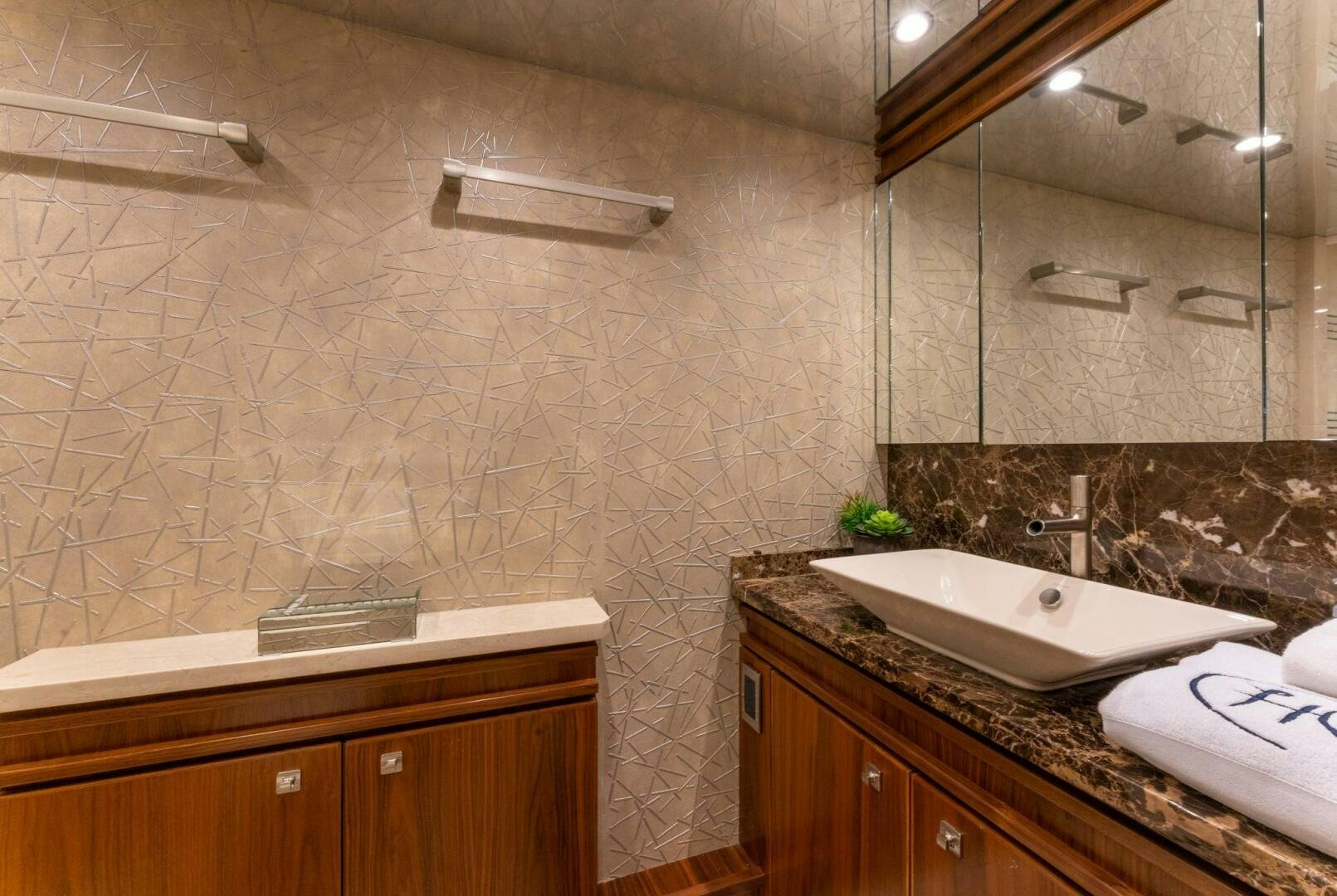 a bathroom with a large mirror aboard HIGH COTTON Yacht for Sale