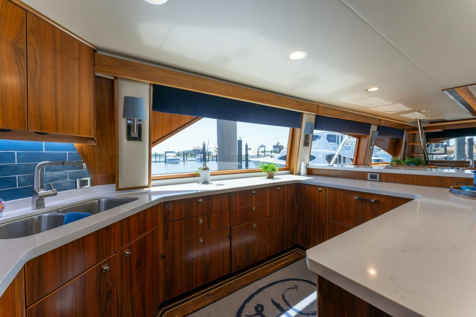 a kitchen with wooden cabinets aboard HIGH COTTON Yacht for Sale