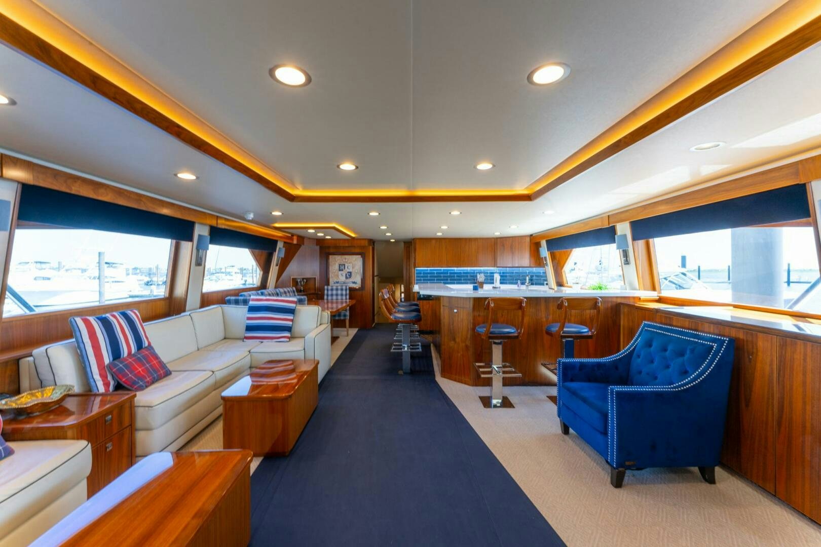a room with a couch and a table and a chair aboard HIGH COTTON Yacht for Sale