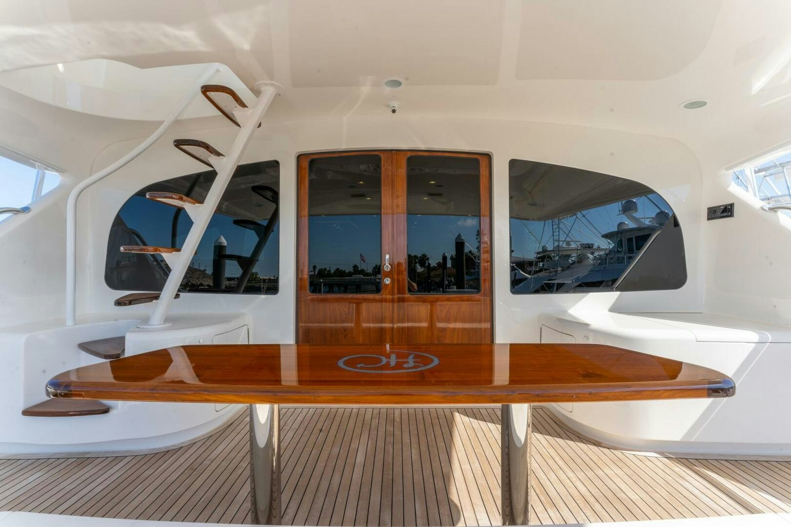 a room with a table and chairs aboard HIGH COTTON Yacht for Sale