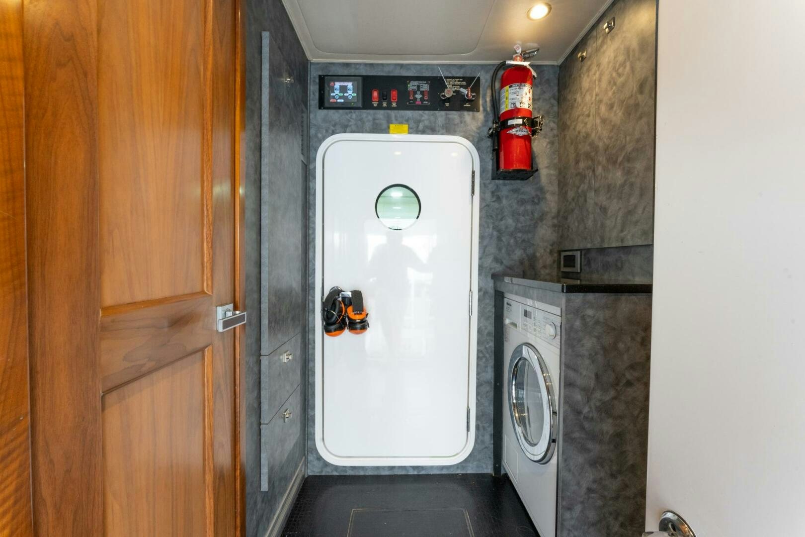 a washer and dryer in a room aboard HIGH COTTON Yacht for Sale