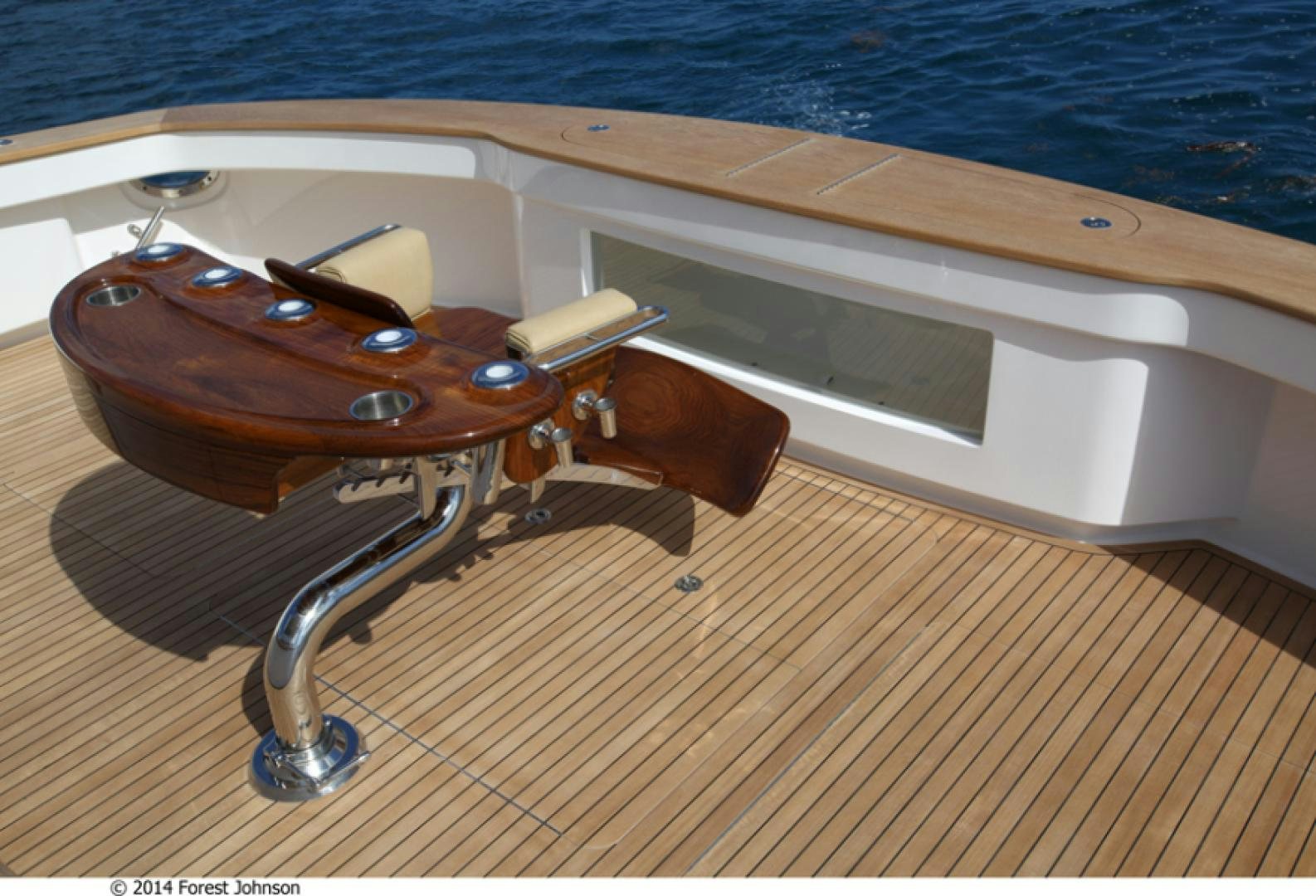 a wooden boat on a wooden surface aboard HIGH COTTON Yacht for Sale