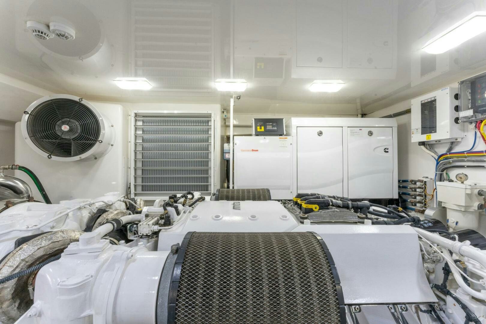 a room with white cabinets and a fan aboard HIGH COTTON Yacht for Sale
