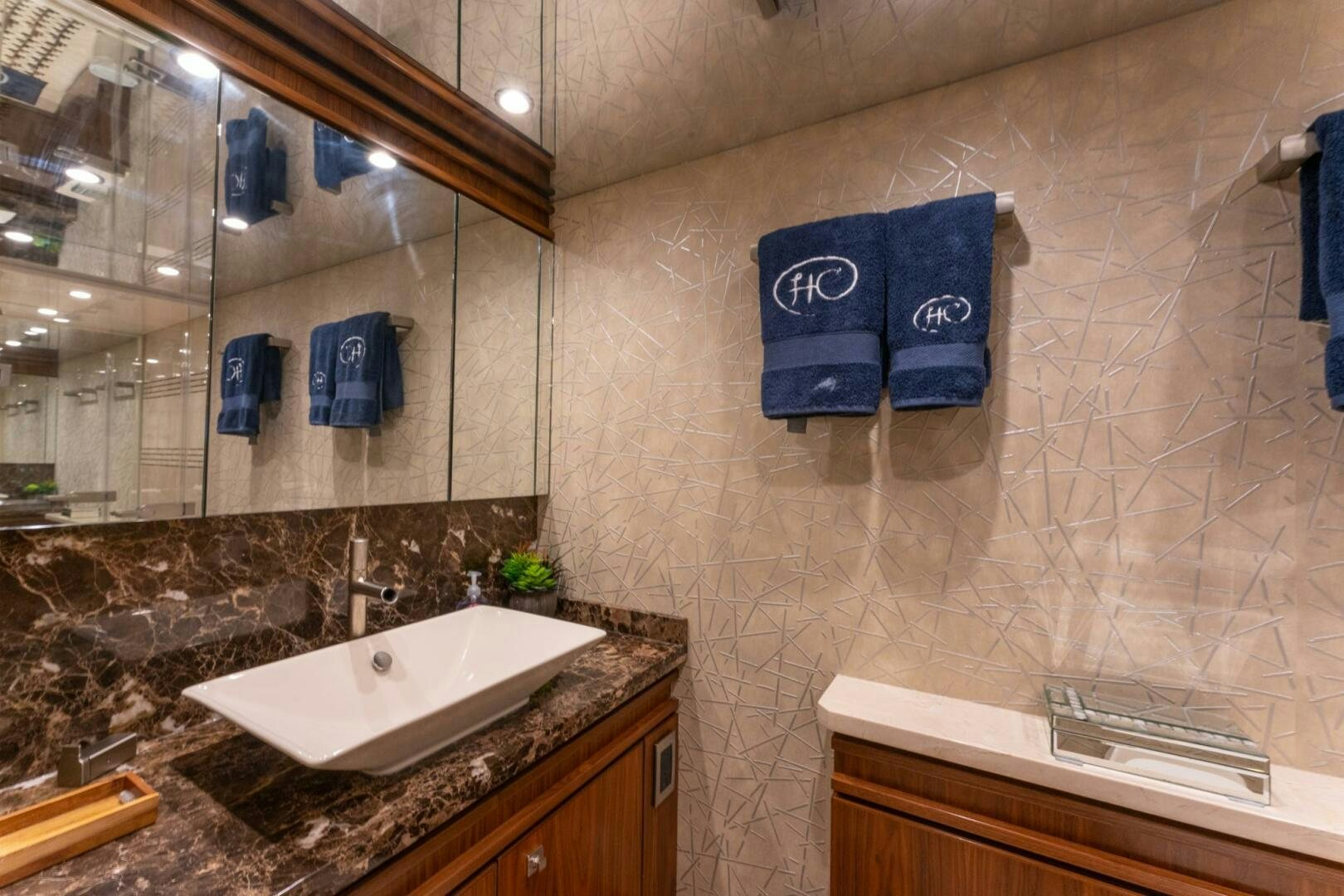 a bathroom with a large mirror aboard HIGH COTTON Yacht for Sale