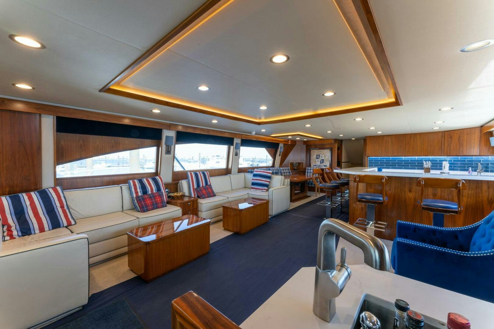 a living room with a large window aboard HIGH COTTON Yacht for Sale
