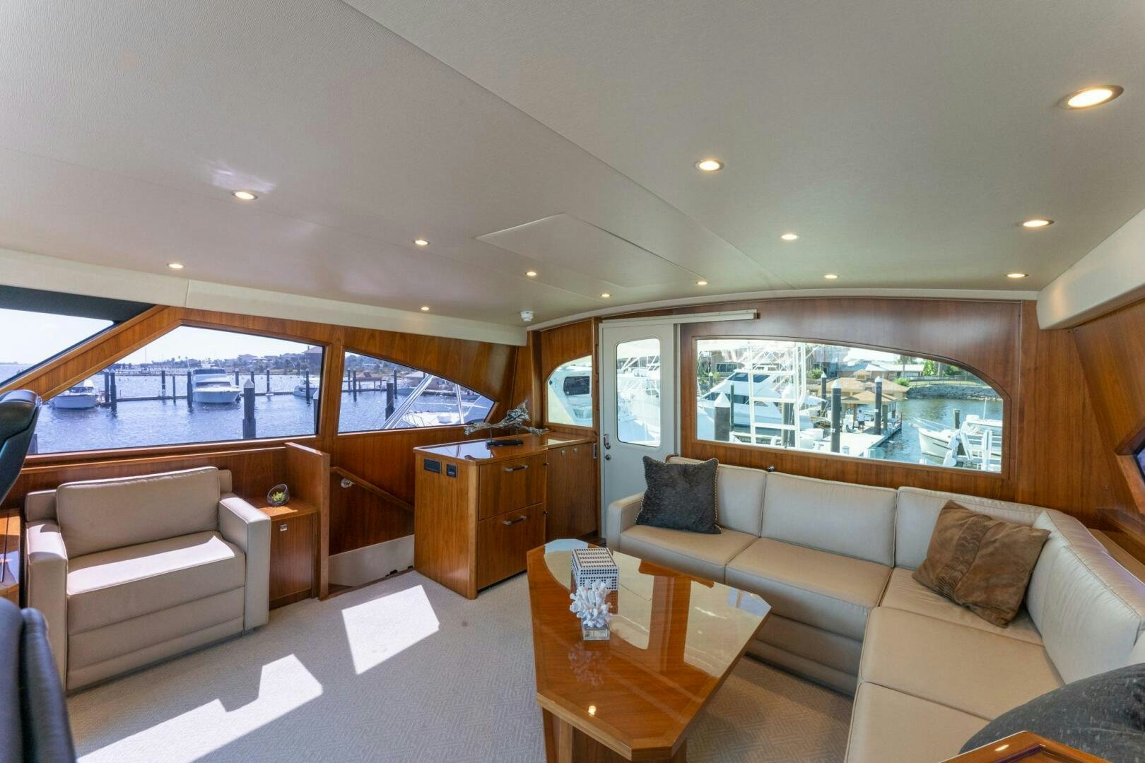 a living room with a large window aboard HIGH COTTON Yacht for Sale