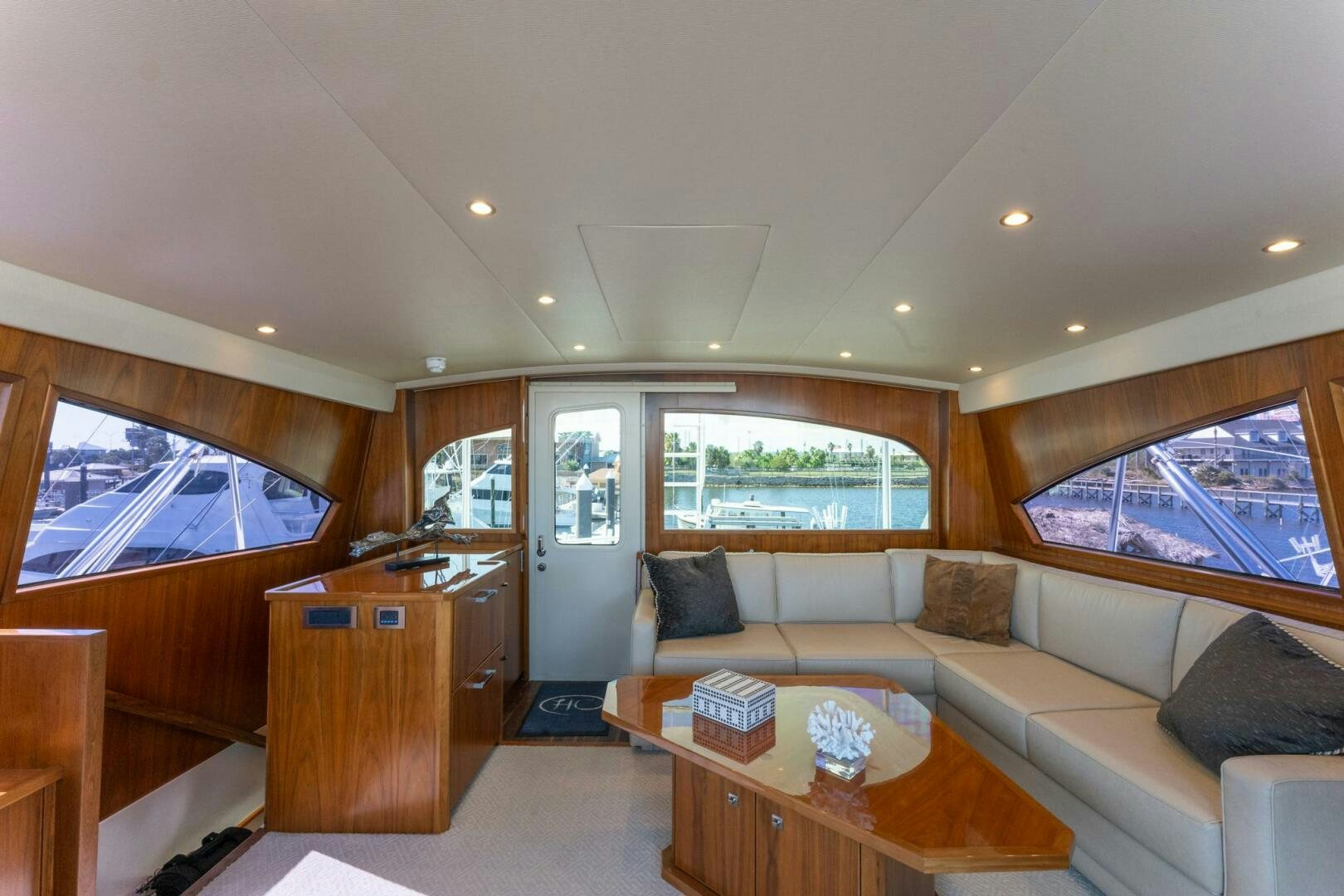 a living room with a couch and a table aboard HIGH COTTON Yacht for Sale