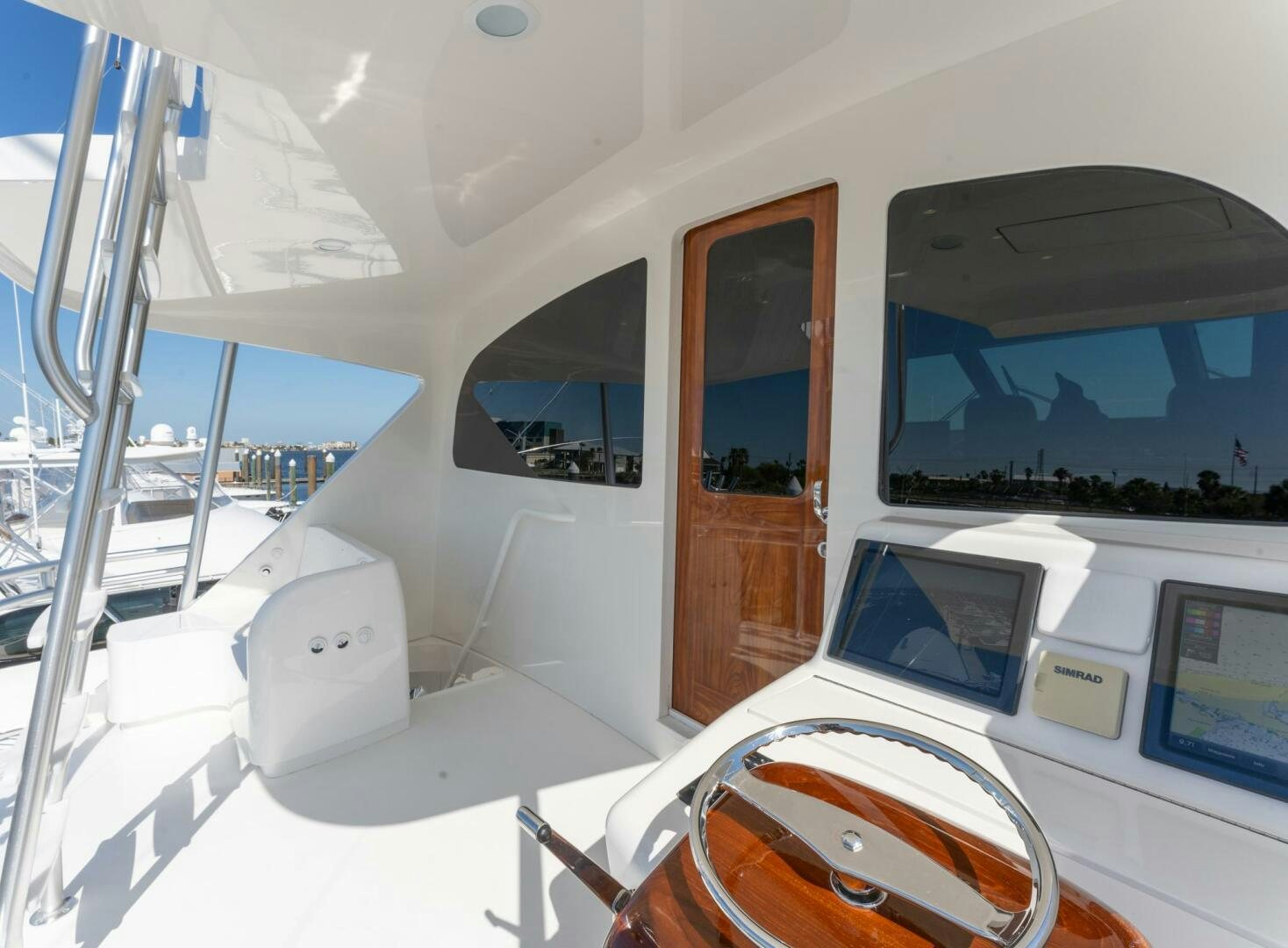 a room with a laptop and a television on the wall aboard HIGH COTTON Yacht for Sale