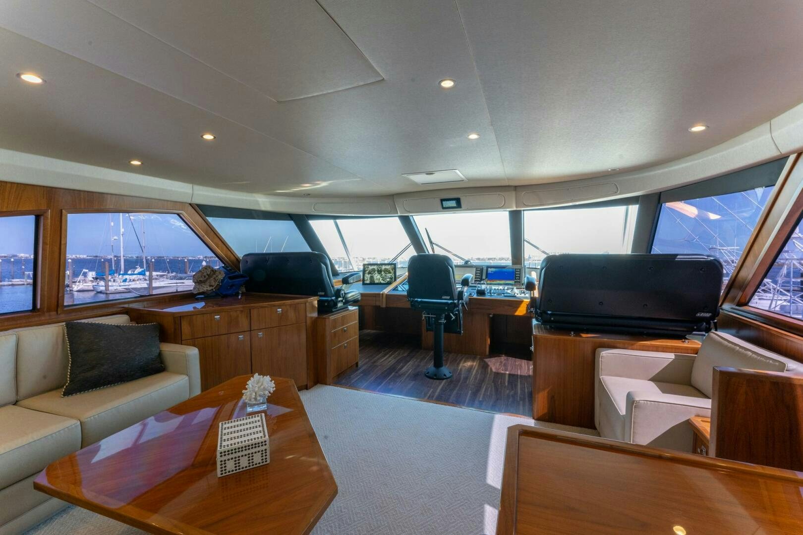 a room with a tv and a couch aboard HIGH COTTON Yacht for Sale