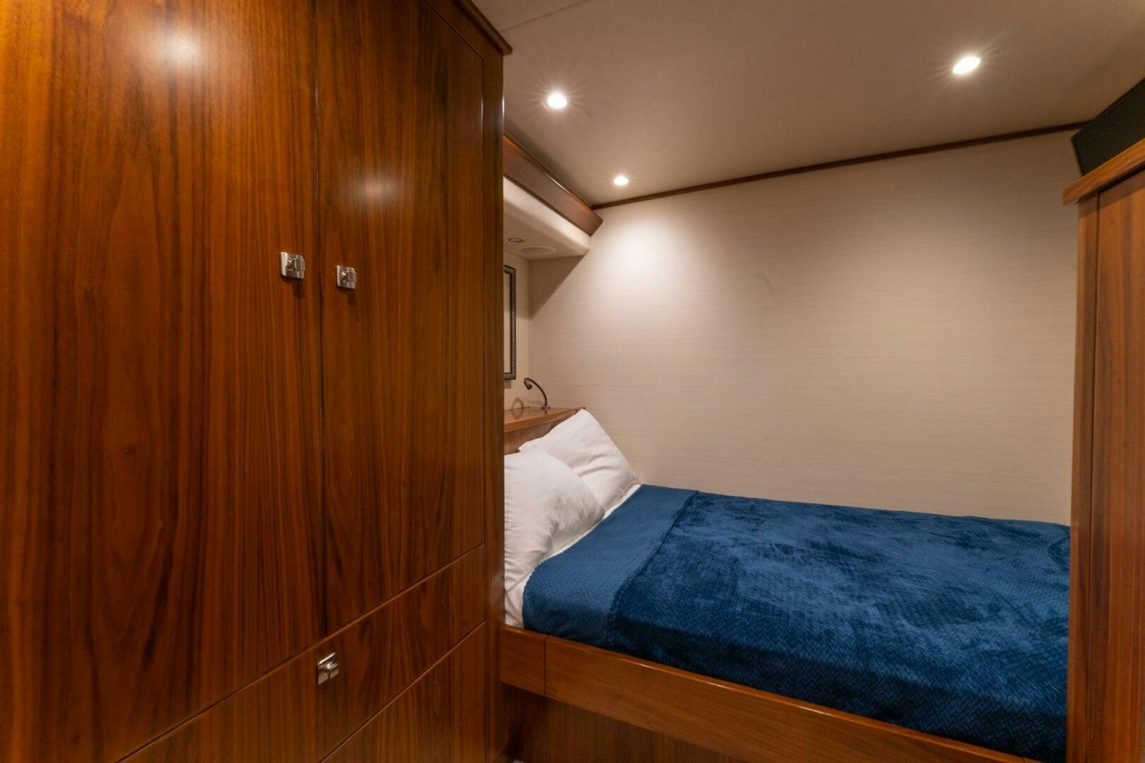 a bed in a room aboard HIGH COTTON Yacht for Sale