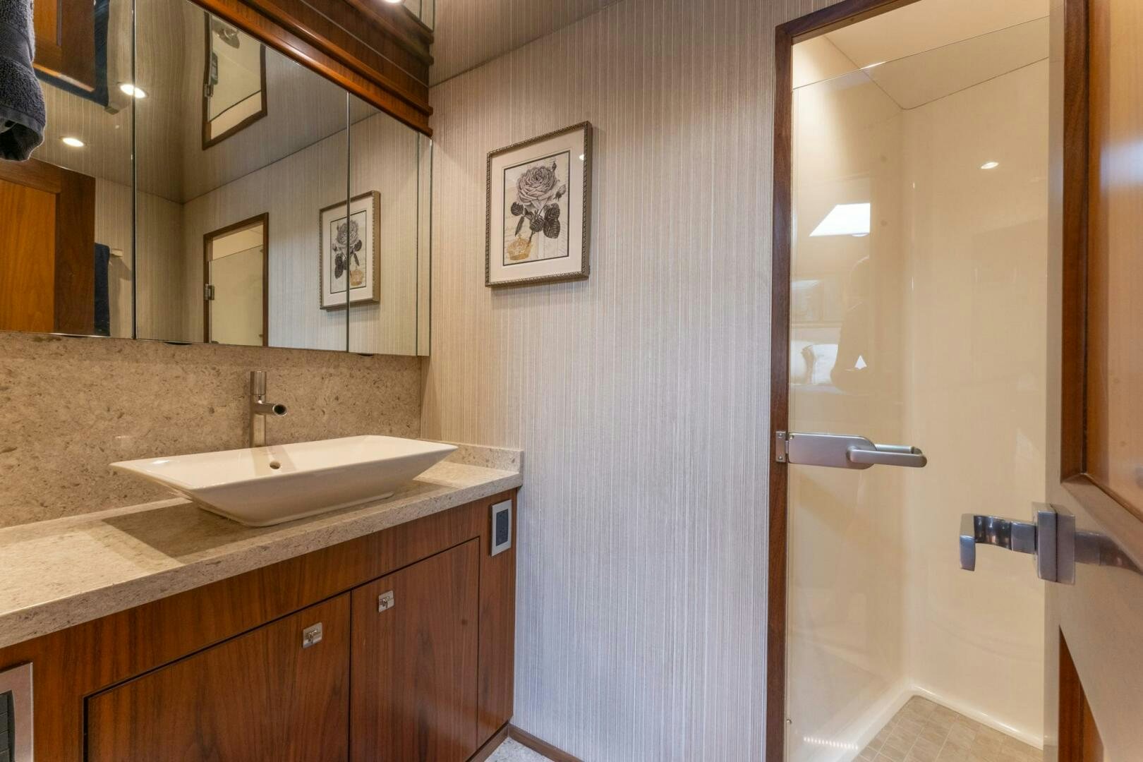 a bathroom with a sink and a mirror aboard HIGH COTTON Yacht for Sale