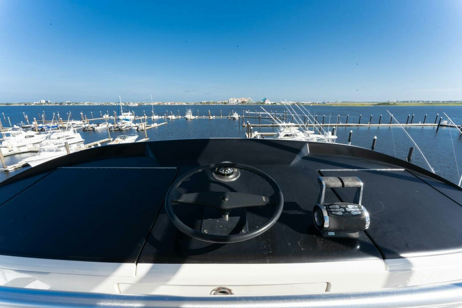 a steering wheel on a dashboard of a car aboard HIGH COTTON Yacht for Sale