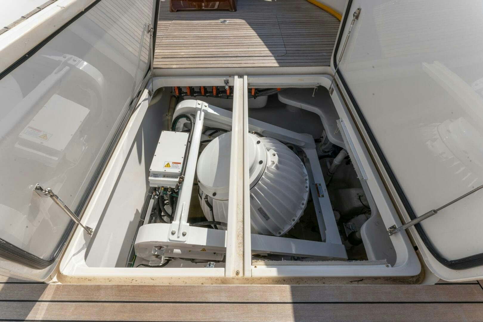 a car with its door open aboard HIGH COTTON Yacht for Sale