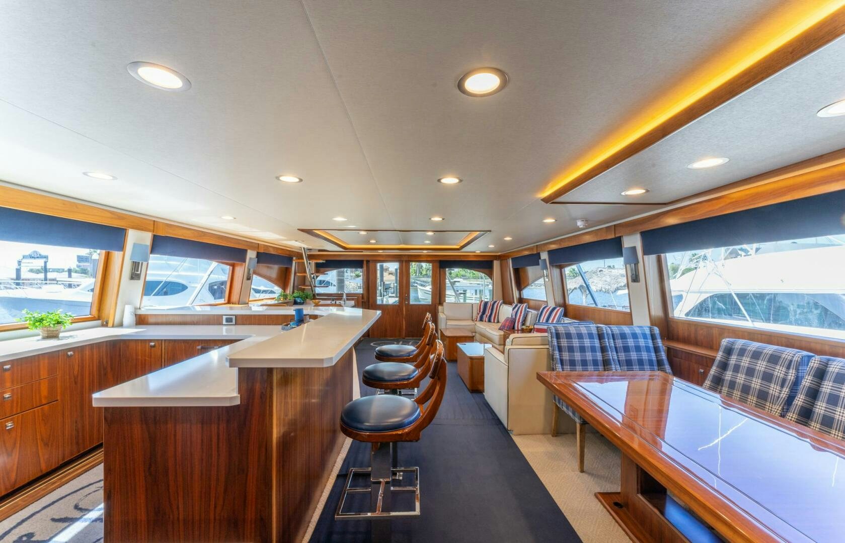 a room with a table and chairs aboard HIGH COTTON Yacht for Sale