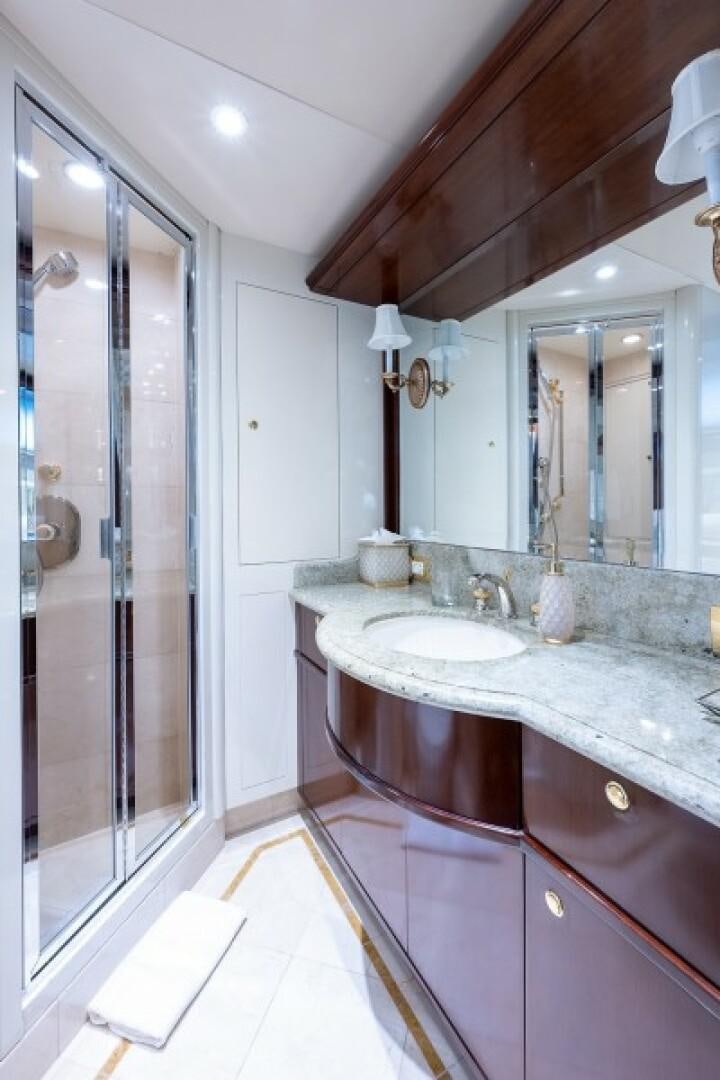 a bathroom with a glass shower aboard STARSHIP Yacht for Sale