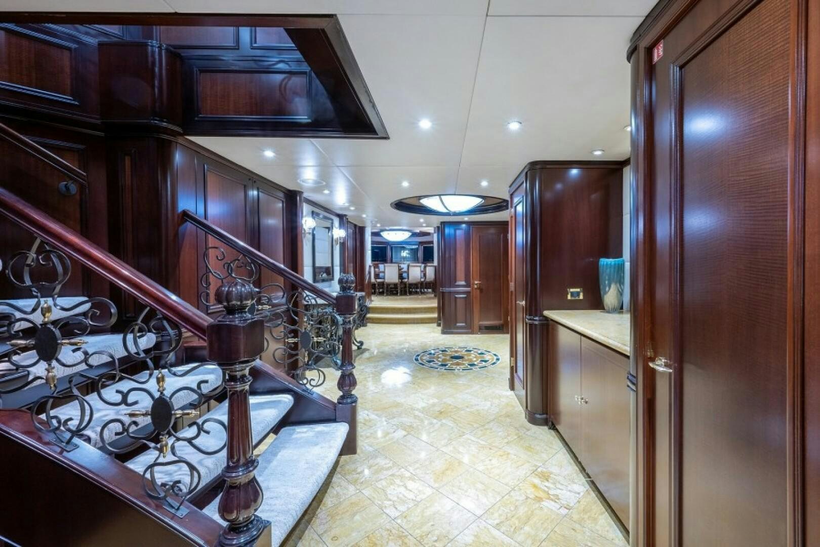 a large room with wood cabinets aboard STARSHIP Yacht for Sale
