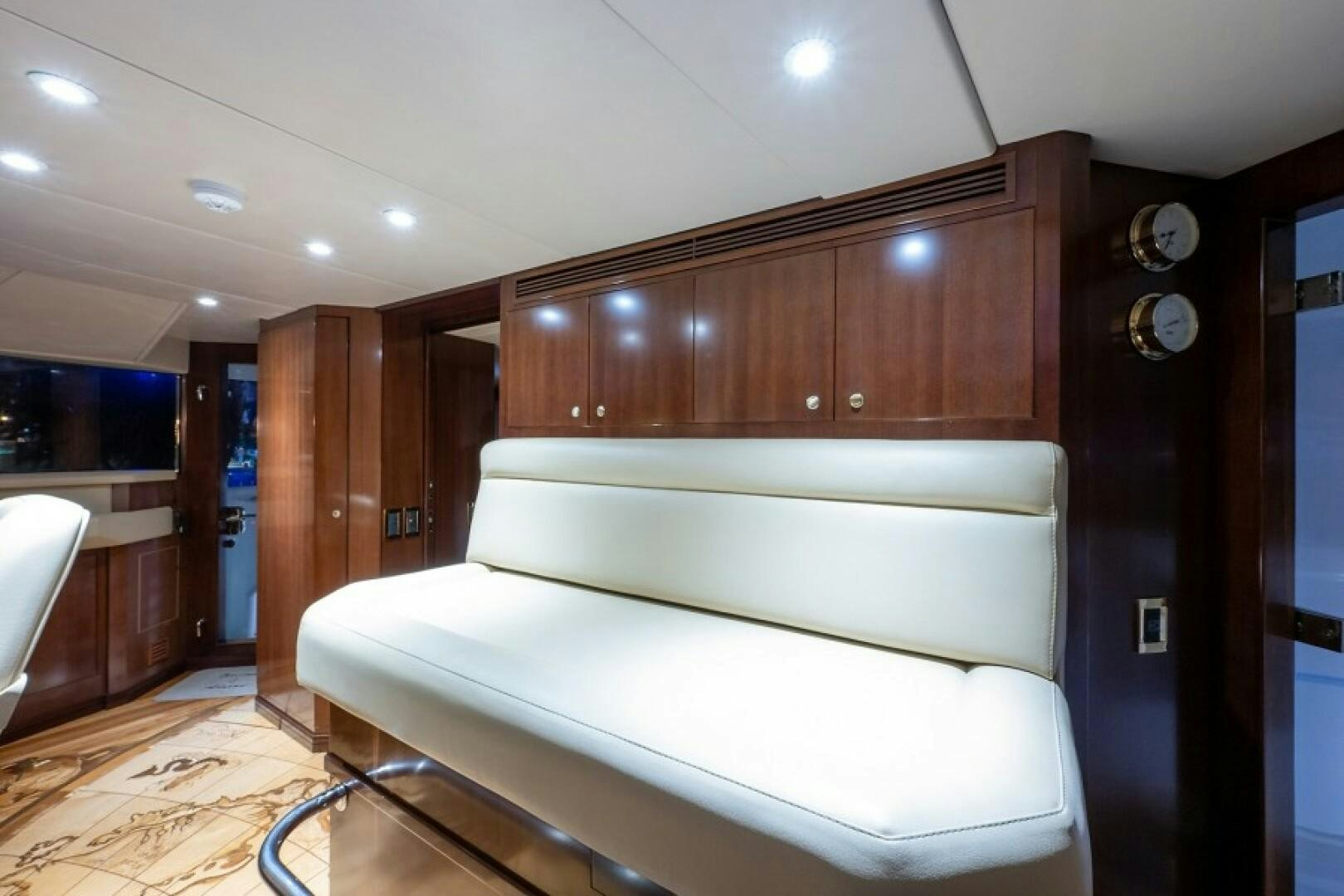a white couch in a room aboard STARSHIP Yacht for Sale