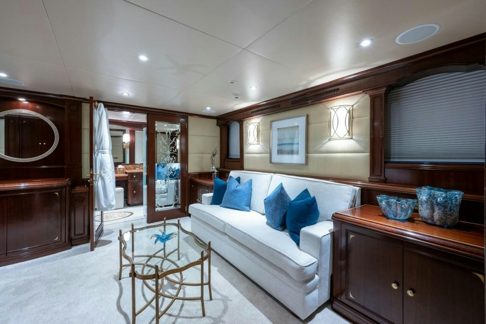 a room with a bed and a table aboard STARSHIP Yacht for Sale