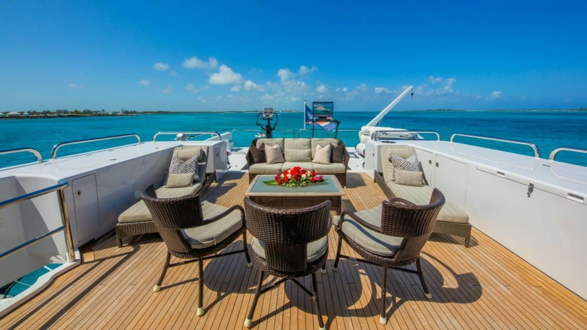 a table and chairs on a boat aboard STARSHIP Yacht for Sale